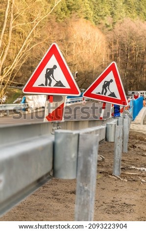 Road sign work on the road. Finishing work on the construction of a bridge on a country road in the Czech Republic. Passage through the construction site.