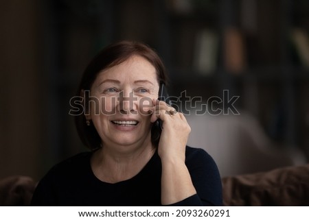 Glad hearing from you. Happy retired lady hold telephone conversation speak with grownup child share positive life news with friend. Pleasant old age woman make call enjoy talking on phone. Copy space Royalty-Free Stock Photo #2093260291