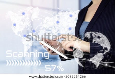 Rule the world, world domination concepts. Hand touch white tablet with digital hologram world, earth, map, globe Location Marker sign on light blurred background
