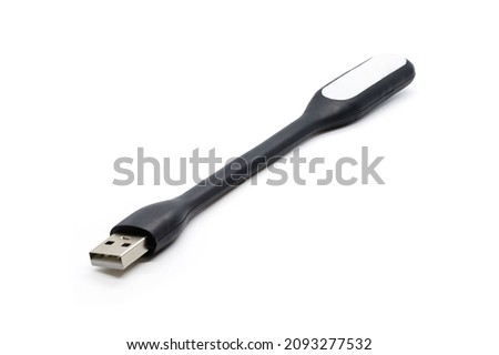 USB black plastic LED light lamp, isolated on a white background. Close-up.
