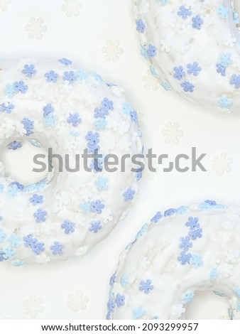 white donuts with blue snowflakes