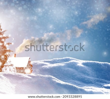 Winter landscape. Rustic wooden house in the snow covered forest. 