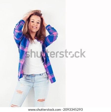 young pretty brunette real girl hipster on white background casual close up dreaming isolated smiling