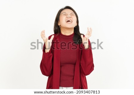 Angry Gesture Of Beautiful Asian Woman Wearing Red Shirt Isolated On White Background
