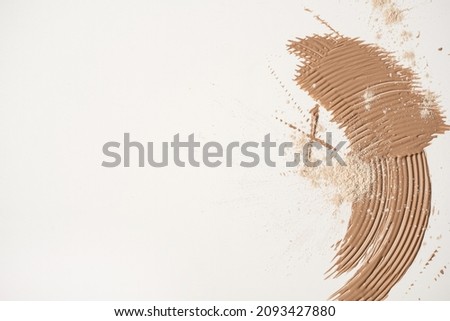 Beauty product. Beige cosmetic cream smear isolated on white background