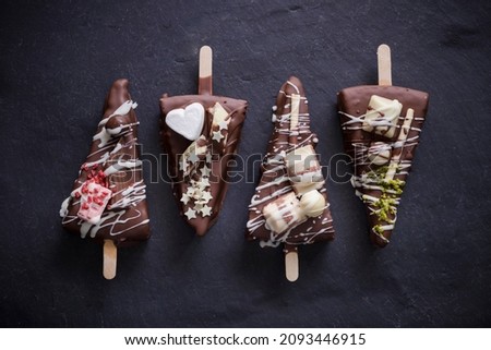 Cheesecake on a stick with chocolate