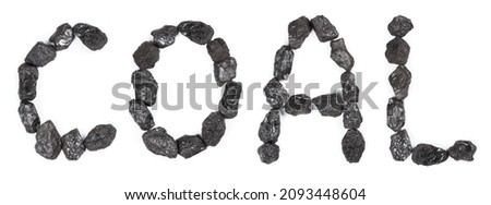 Word Coal made from black stone coal isolated on white background top view. Royalty-Free Stock Photo #2093448604