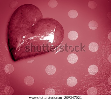 Pink heart with retro polka dot background in square orientation.  