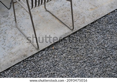 Chair leg lines with concrete floor and stone , absract art for background