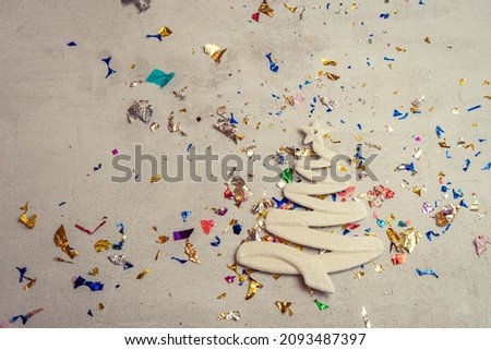 figure of a Christmas tree in a serpentine on a concrete background , the concept of Christmas and gifts , Christmas sales