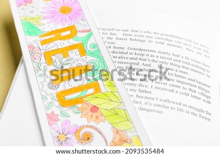 Cute bookmark with book, closeup