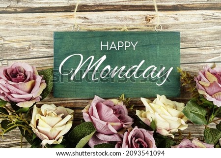 Happy Monday typography text with roses flowers bouquet on wooden background