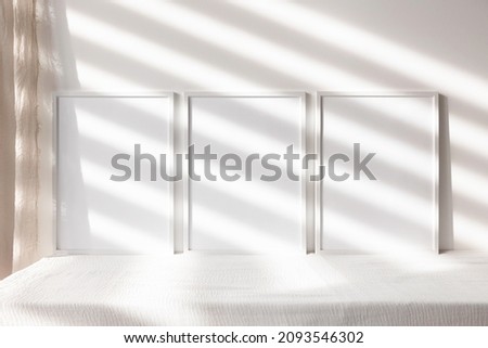 Mockup with three white photo frame 3x4 Royalty-Free Stock Photo #2093546302