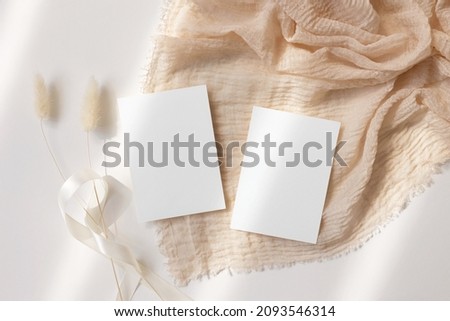 RSVP card mockup on being background  Royalty-Free Stock Photo #2093546314