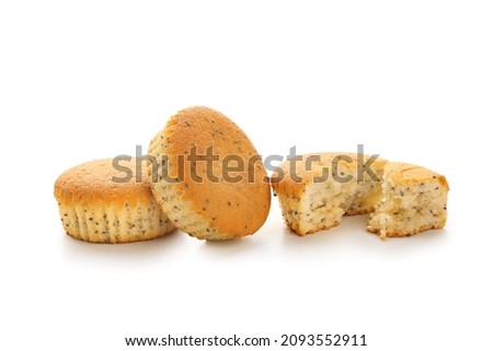 Delicious muffins with poppy seeds on white background