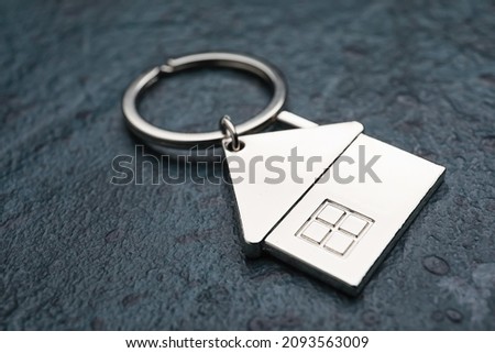 House shape keychain on dark background