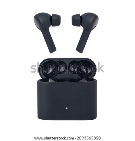 Wireless headphones on a white background. Headset close up in the charging case. Royalty-Free Stock Photo #2093565850