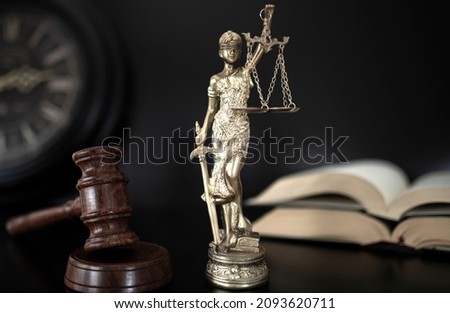 justice and law concept over black wooden