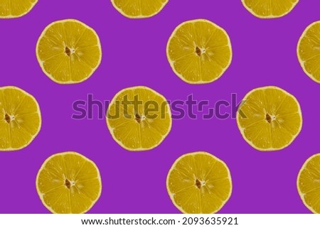 Fruit pattern. Colorful pattern of lemon slices on a purple background. Photo collage. Minimum sample of summer fruits for recipes. Summer concept.