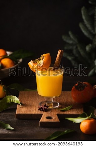 Persimmon and tangerine juice bourbon cocktail, front view