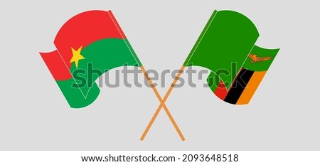 Crossed and waving flags of Burkina Faso and Zambia. Vector illustration
