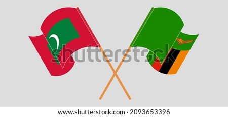 Crossed and waving flags of Maldives and Zambia. Vector illustration
