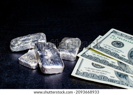 silver bars and hundreds of dollars