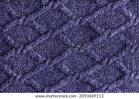 Handmade colour knitting wool texture background. New 2022 trending PANTONE 17-3938 Very Peri color