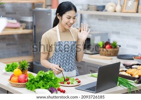 image of asian woman preparing salad in the kitchen Royalty-Free Stock Photo #2093726185