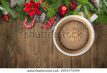 Welcome 2021 theme coffee cup on wooden table with dried pine branches. Happy new year 2021, Holidays food art concept.