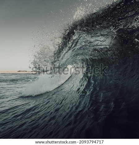 A wave creating a barrel seen from the water