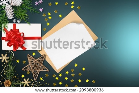 Christmas letter envelope with blank paper card, white gift box, fir branches