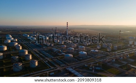 Aerial view of Oil and gas industry - refinery at sunset - factory - petrochemical plant, Shot from drone of Oil refinery and Petrochemical plant at dusk , Pancevo, Serbia. Royalty-Free Stock Photo #2093809318