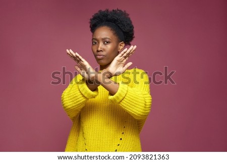 Serious young african american woman show stop finish gesture by crossed hands, protest against racial discrimination Royalty-Free Stock Photo #2093821363