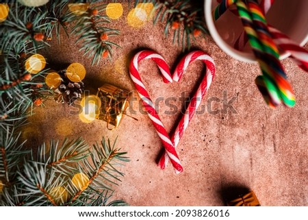 Christmas composition. A Christmas tree decorated with toys and a garland and Christmas Cane. High quality photo