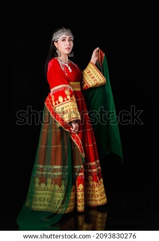 Beautiful photo of an afghan model girl in traditional Afghani clothes  Royalty-Free Stock Photo #2093830276