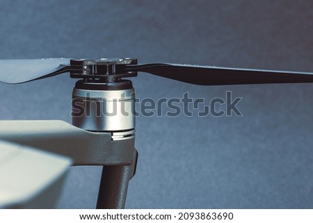 Close-up of drone propellers and brushless motor. Quadcopter blades. Drone maintenance. Royalty-Free Stock Photo #2093863690