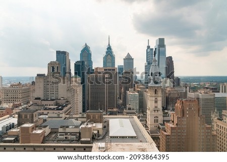 Aerial panoramic cityscape of Philadelphia financial downtown, Pennsylvania, USA. Philadelphia City Hall Clock Tower at summer day time. A vibrant business and cultural neighborhoods.
