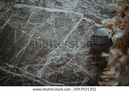 Natural marble granite stone background pattern with high resolution. Top view. Copy space. White cracked concrete wall covered with gray cement surface as background