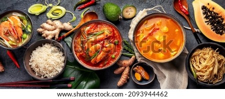 Traditional Thai food on dark background. Oriental food concept. Top view, flat lay, panorama Royalty-Free Stock Photo #2093944462
