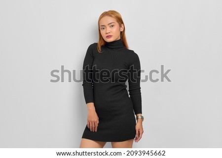 Portrait of gorgeous elegant Asian woman wearing fashion black dress isolated on white background