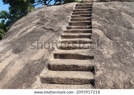 Staircase carved into the rock. Against the backdrop of rock and nature