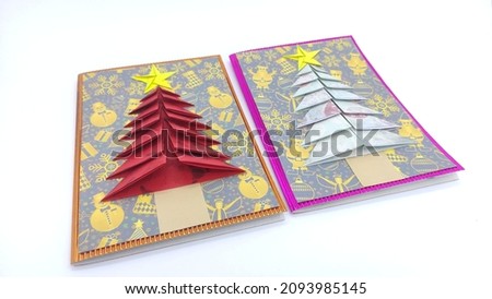 Handmade origami paper craft red, yellow, purple, blue, green Christmas tree cards greetings isolated on white