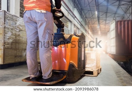 Worker Driving Electric Forklift Pallet Jack Loading Package Boxes into Cargo Container. Delivery service. Trucks Loading at Dock Warehouse. Supply Chain Shipments. Shipping Transport  Logistics	
 Royalty-Free Stock Photo #2093986078