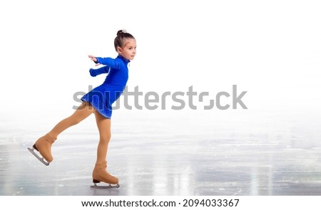 Little young figure skater posing in blue training dress on ice on white background