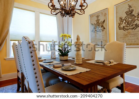 Served dining table with flower and statues