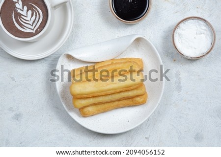 Churros,spanish traditional dessert and chocolate dipping