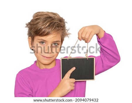 portrait smiling boy showing black board for copy space, isolated on white background