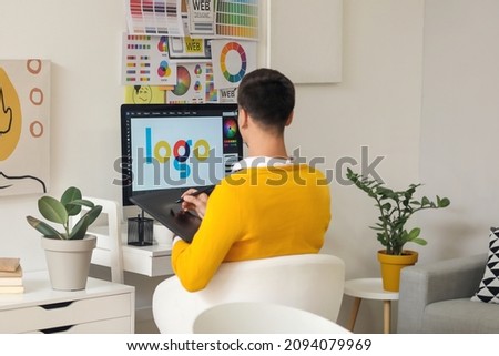 Graphic designer working in office Royalty-Free Stock Photo #2094079969