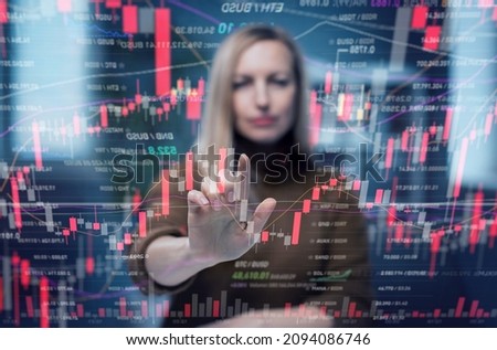 Mature woman using virtual screen full of crypto stock graphics, financial data of future